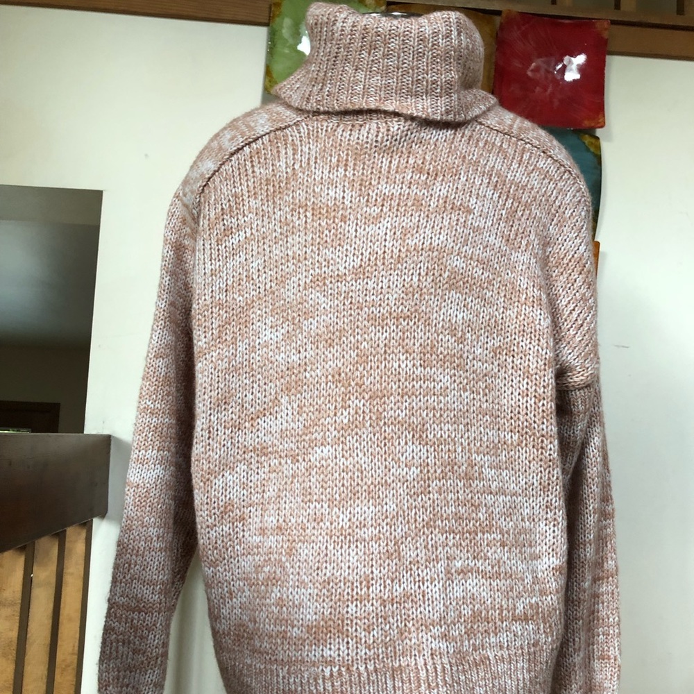 Pink knit turtleneck sweater
